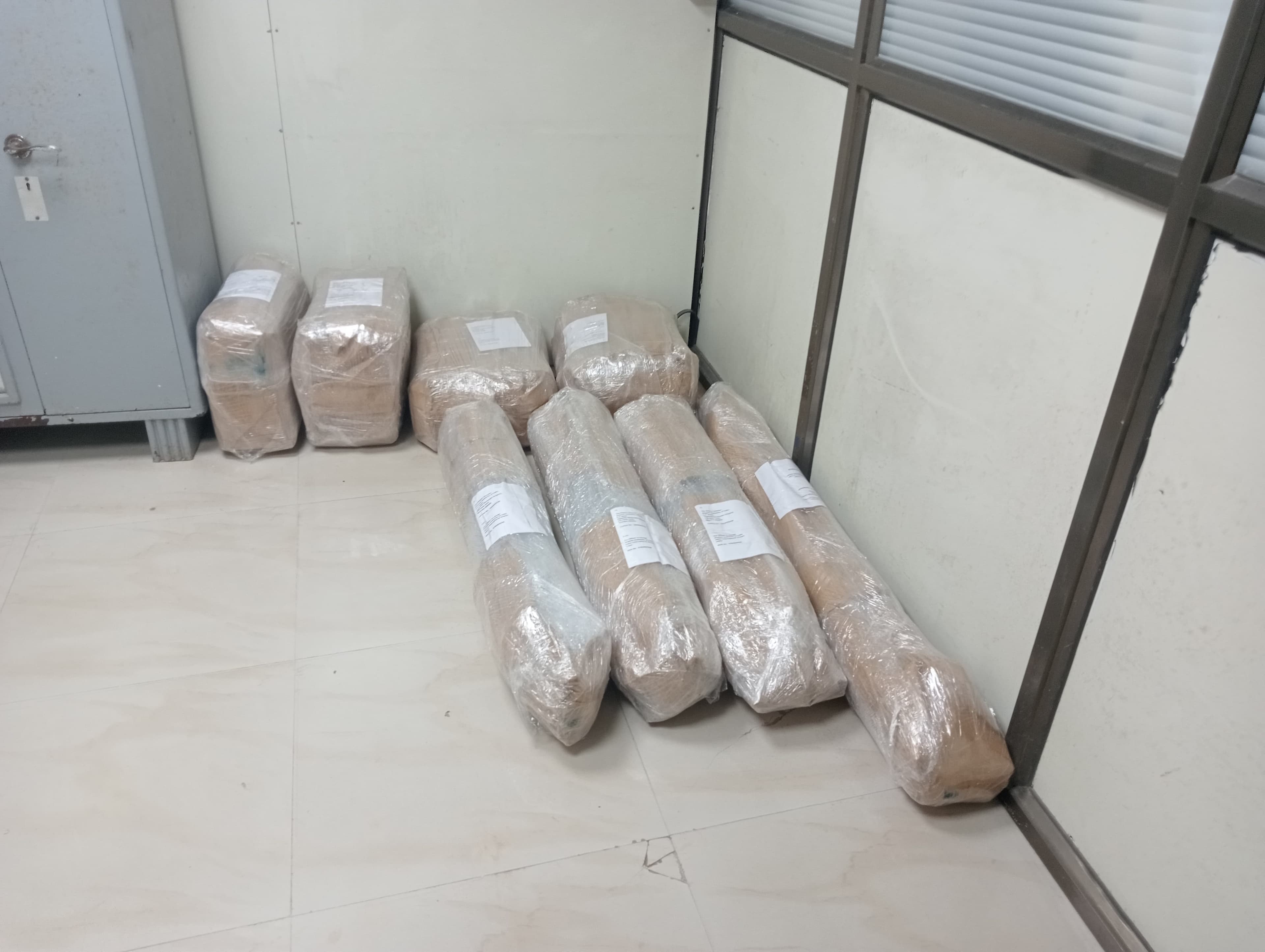 Movers assembling furniture in a new home