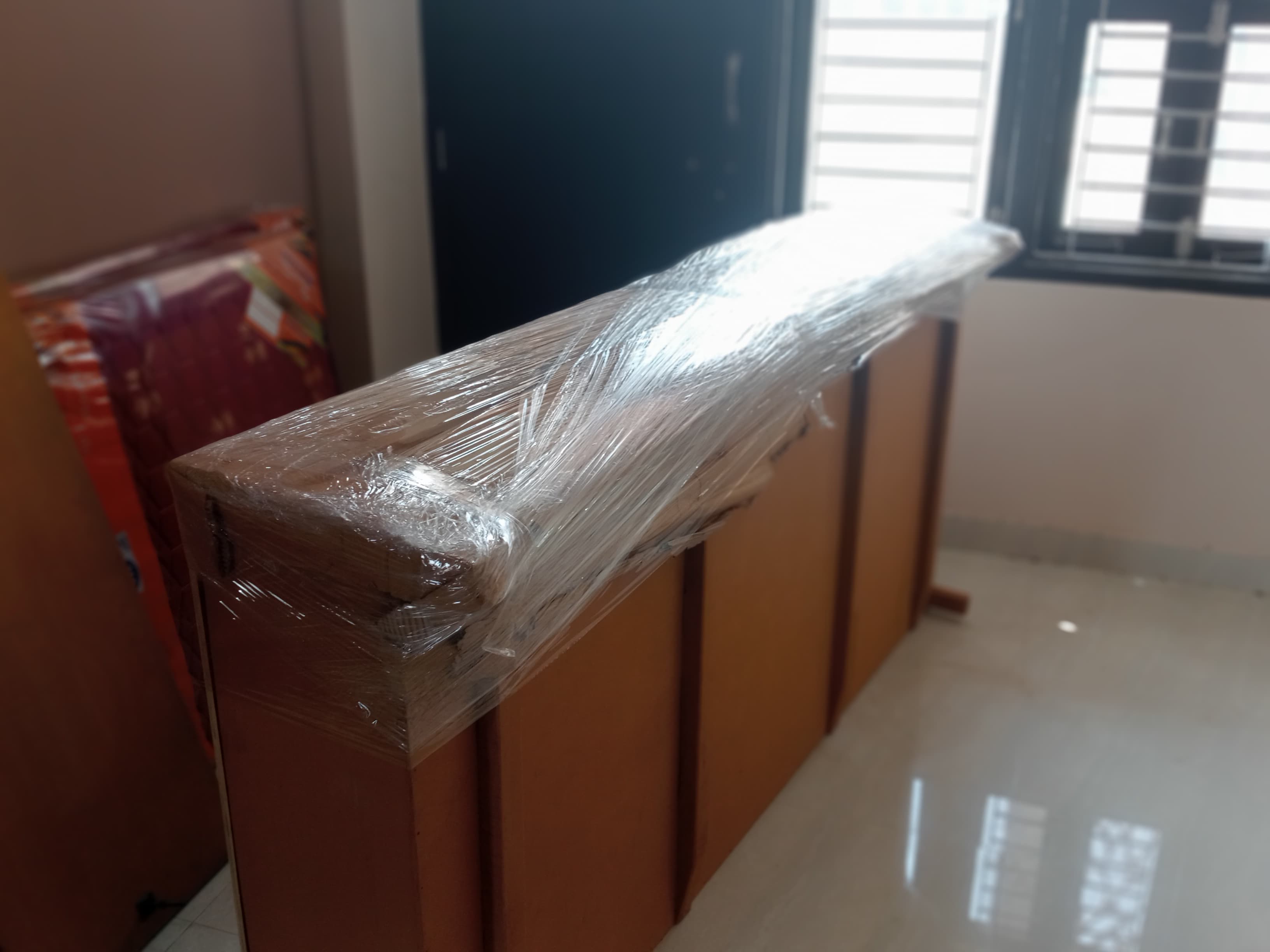 Unloading a mattress at a new residence