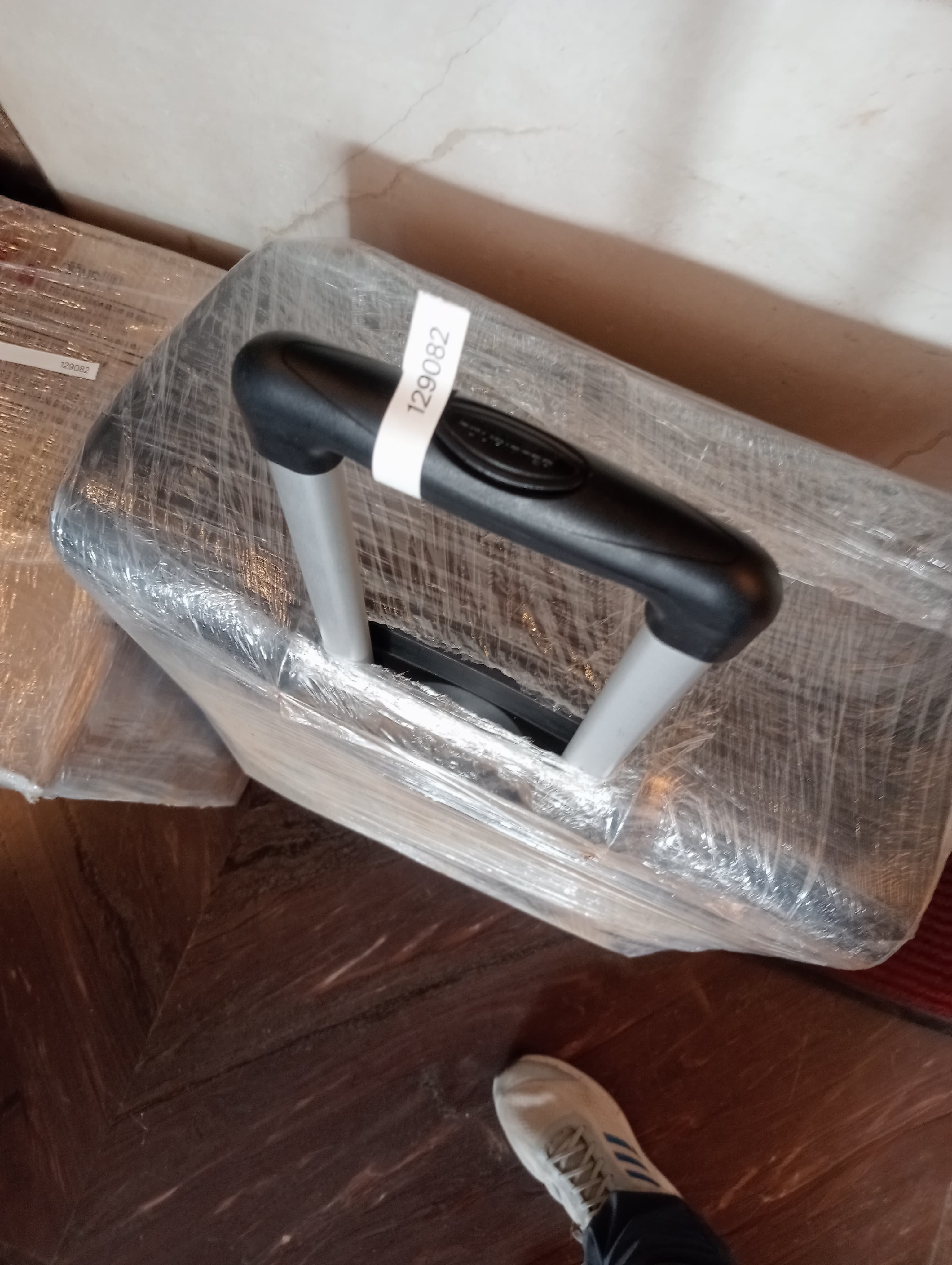 Moving truck parked near a corporate building