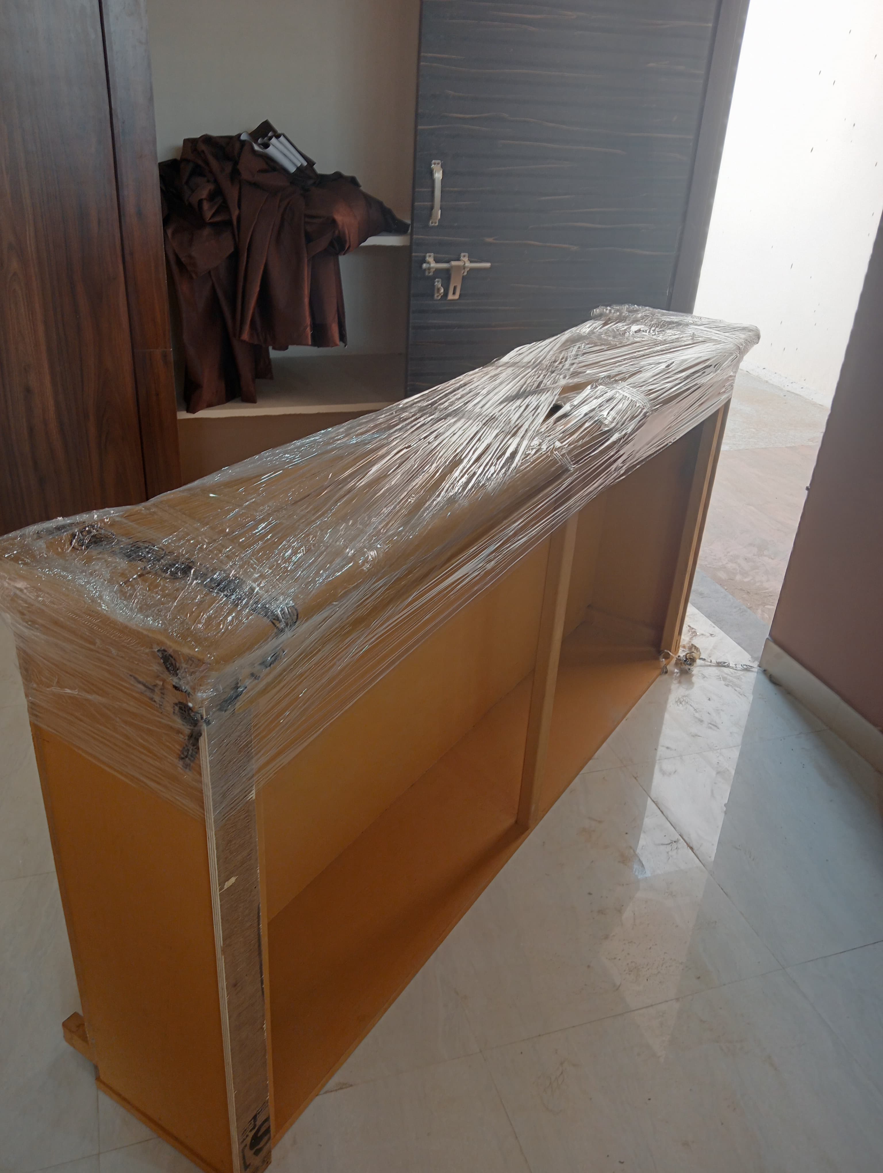 Packing clothes into wardrobe boxes