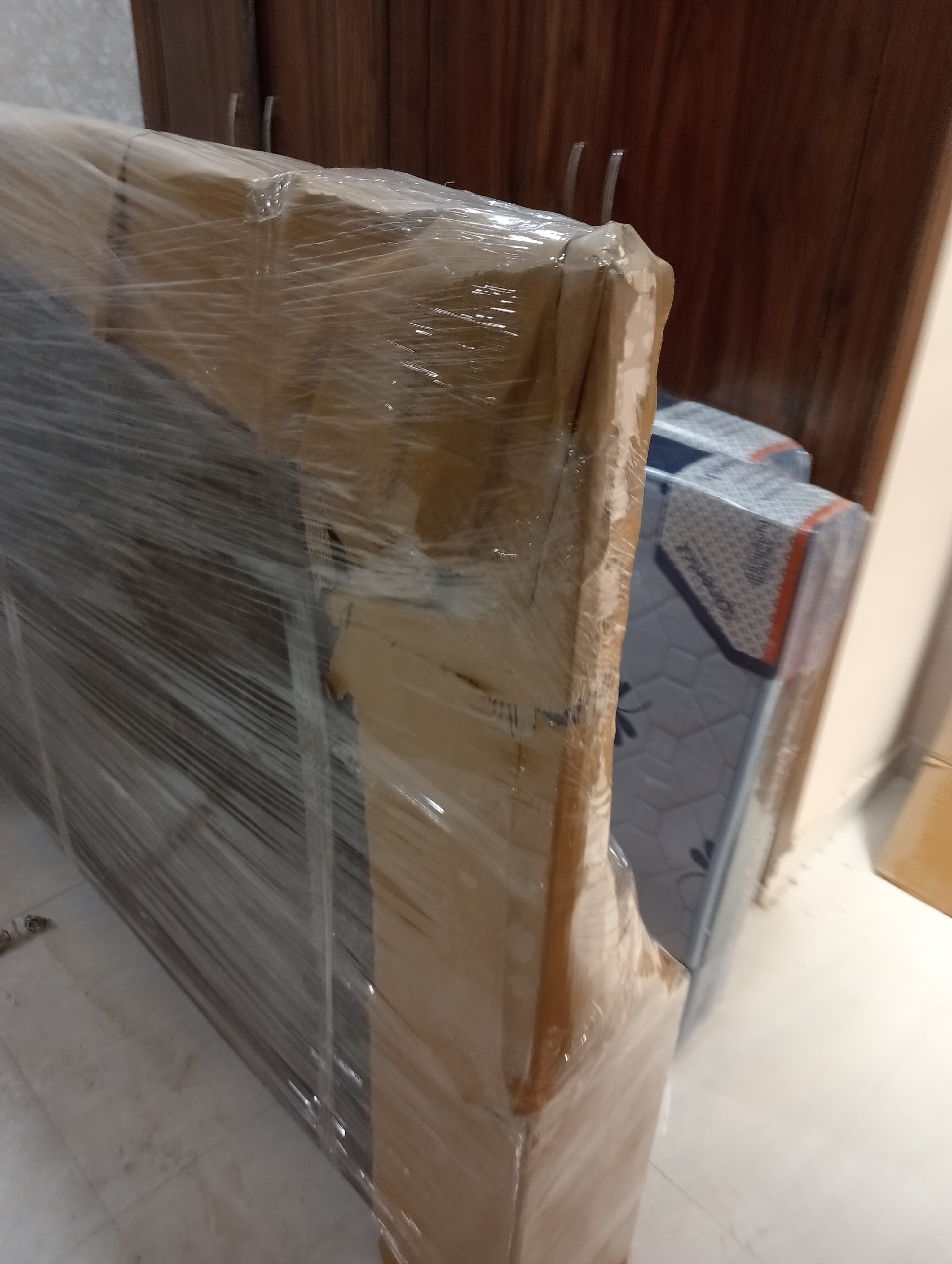 Movers unpacking a kitchen in a new apartment