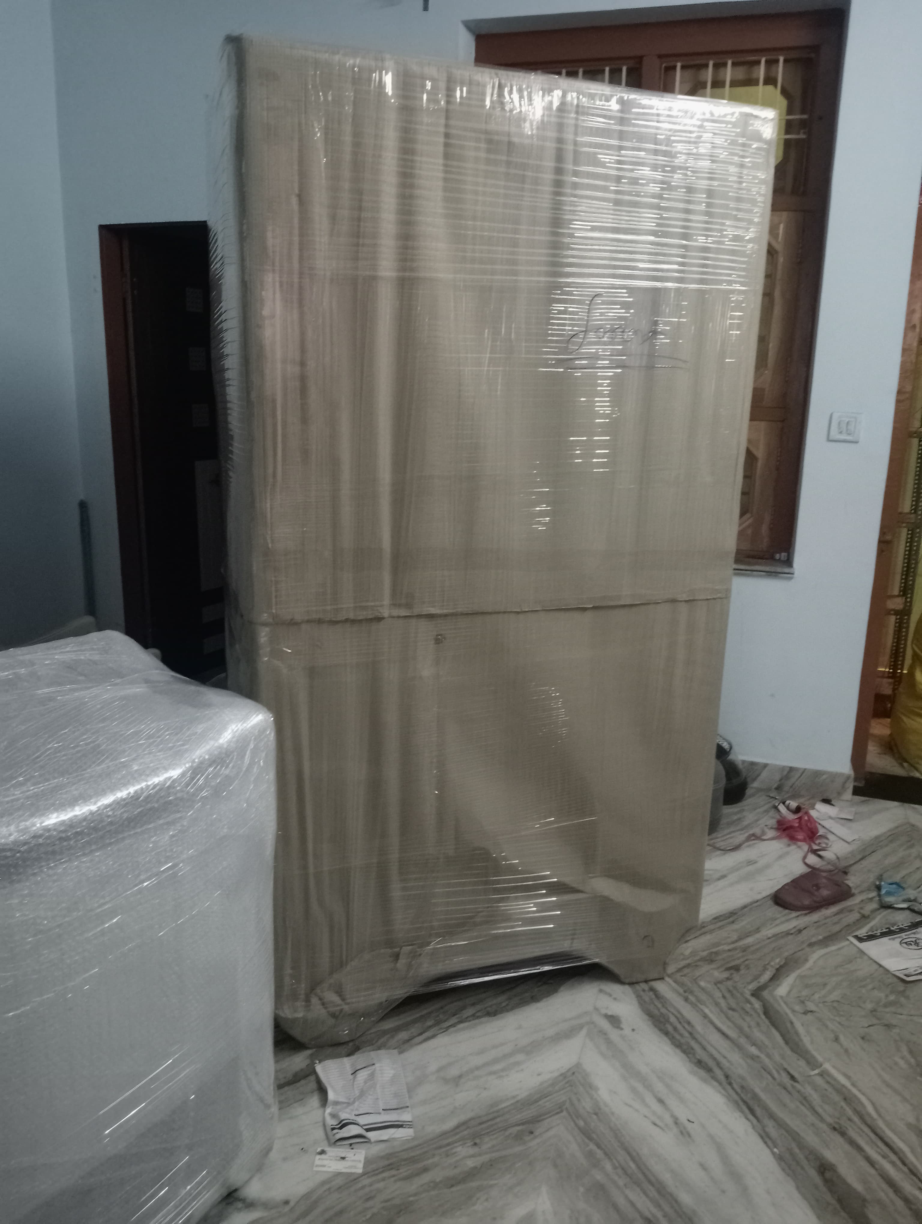 Team assembling a bed in a new home