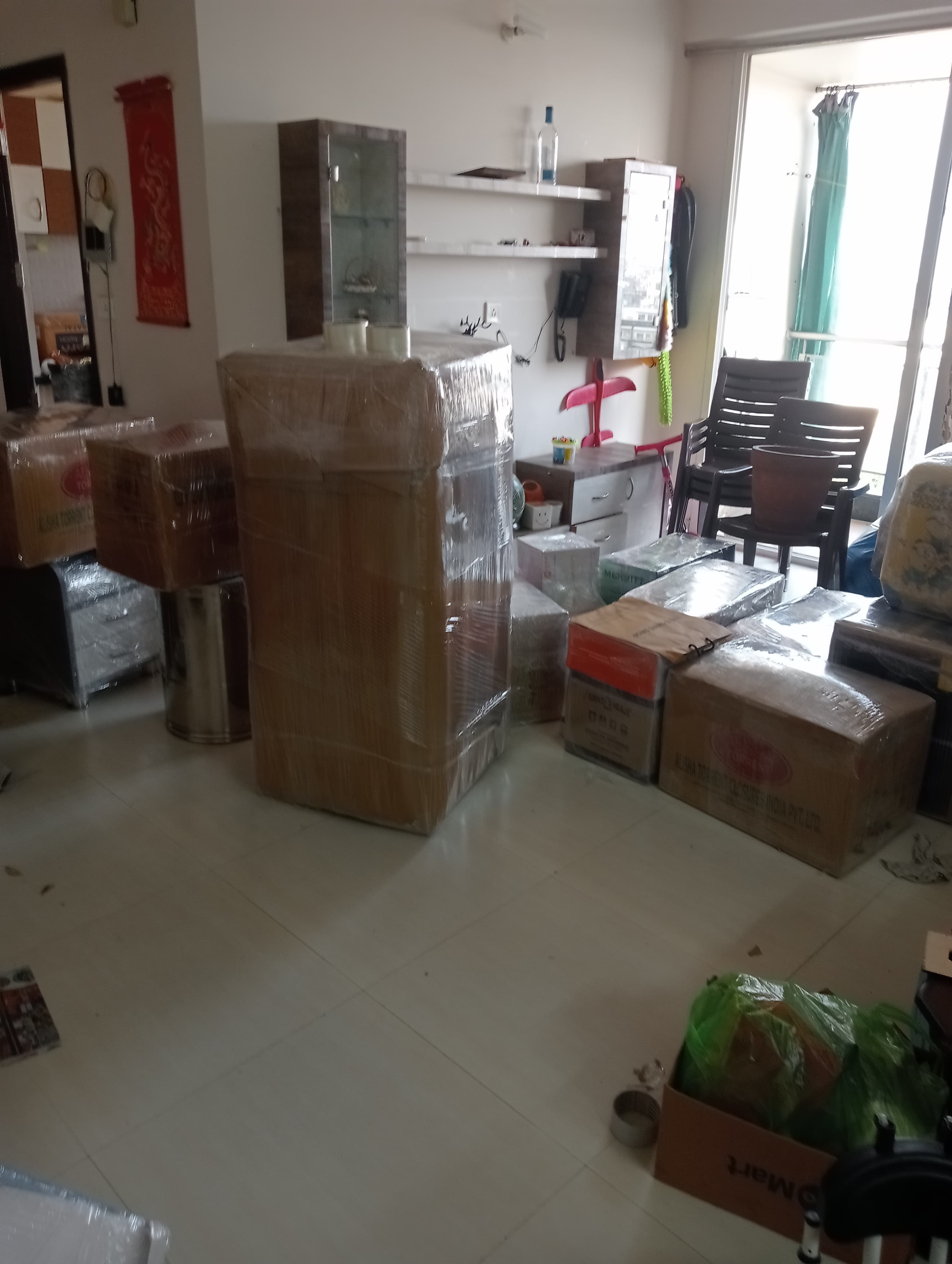 Family unpacking bookshelves in their new home