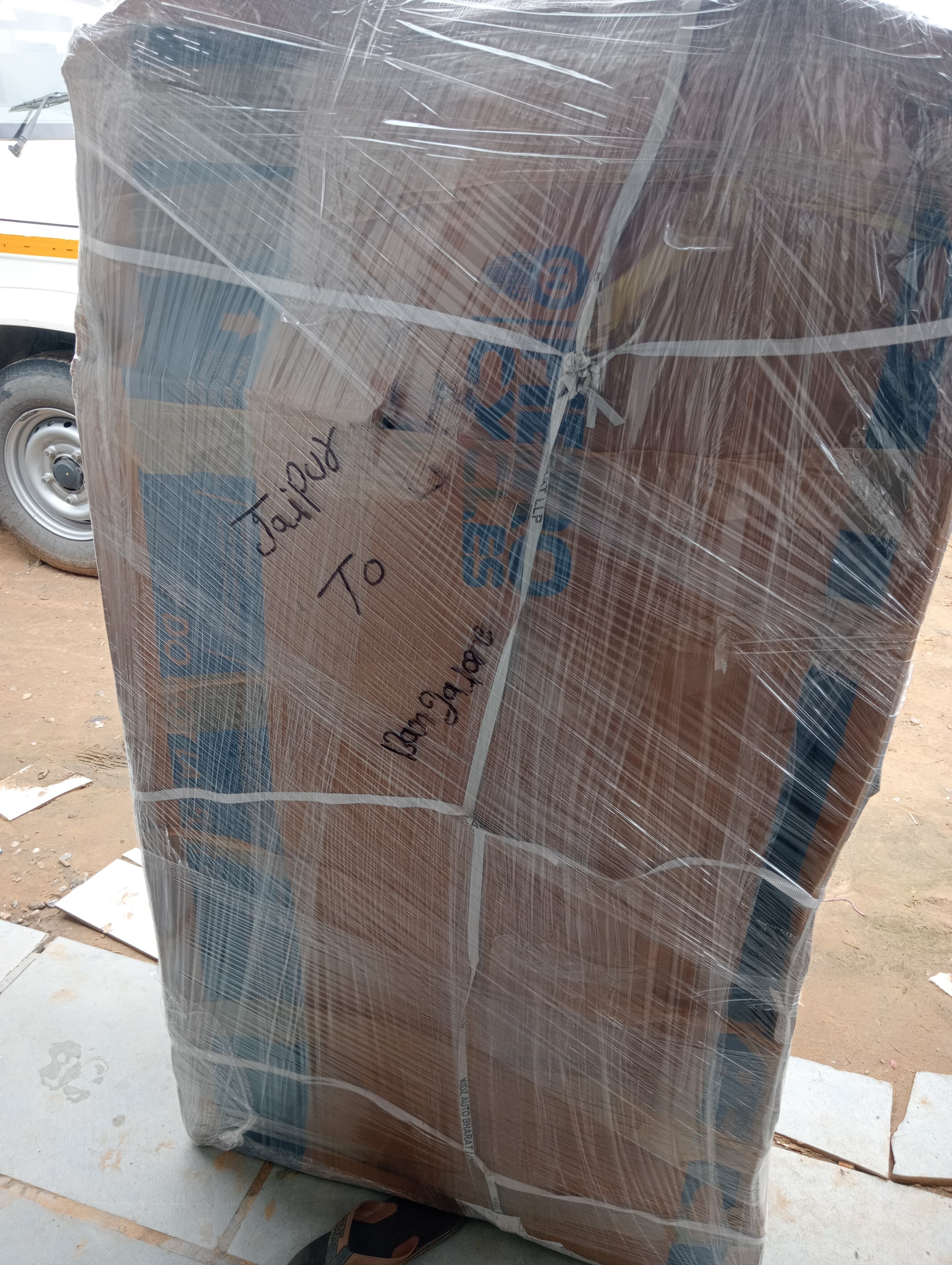 Movers loading outdoor furniture into the truck