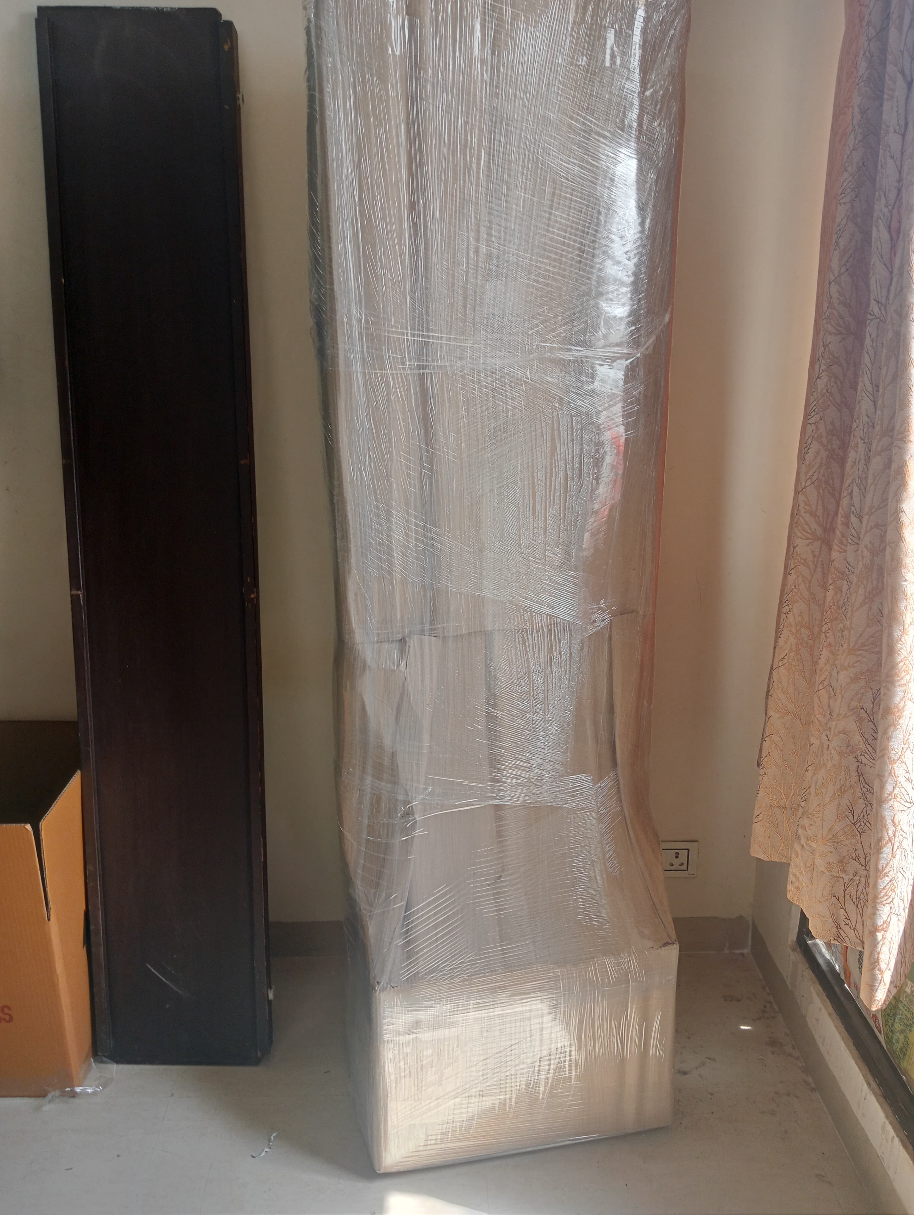 Movers carefully handling antique furniture