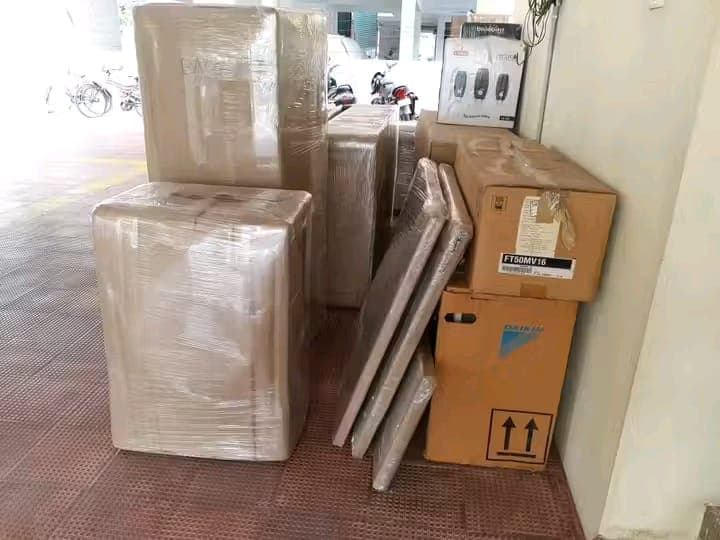 Moving truck parked at a commercial building