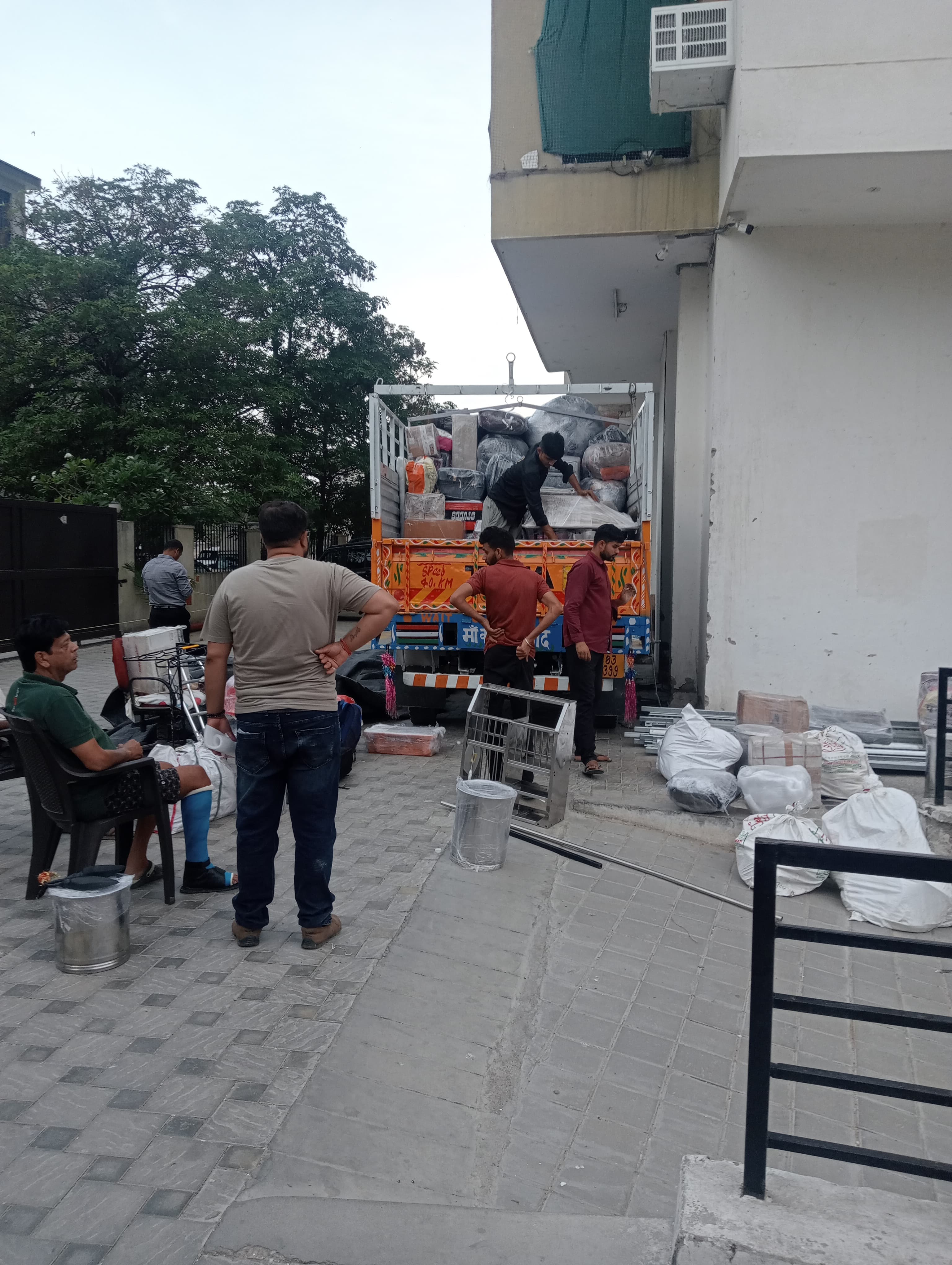 Moving truck navigating through city traffic